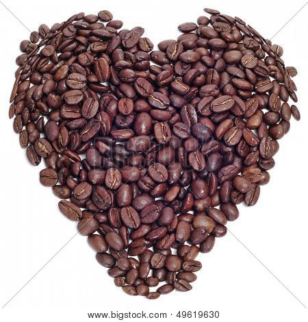a pile roasted coffee beans forming a heart on a black background