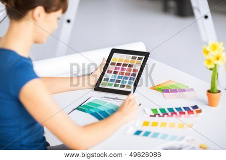interior design, renovation and technology concept - woman working with color samples for selection