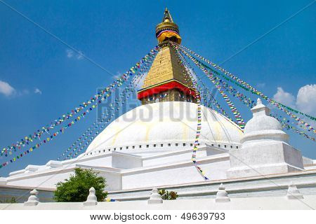 Buddhist shrine Boudhanath Stupa with Buddha wisdom eyes and praying flags in Kathmandu, Nepal