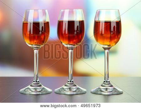 Glass of amaretto liquor, on bright background