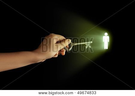 Close-up of human hand holding key. Idea concept