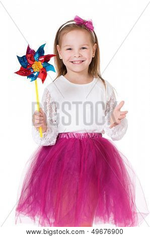 Portrait of little girl holding weathercock, isolated on white background 