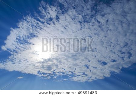 Blue Sky With Clouds And Sun Rays