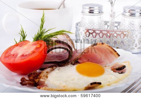 Fried eggs on a frying pan with olive oil