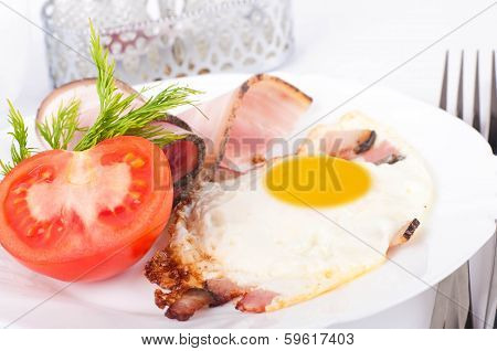 Fried eggs on a frying pan with olive oil