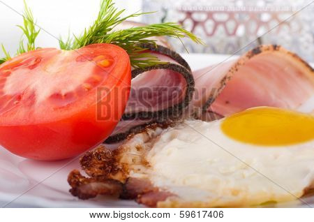 Fried eggs on a frying pan with olive oil