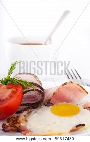 Fried eggs on a frying pan with olive oil