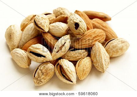pile of peeled and inshell almonds - delicious and healthy nuts