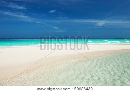Beautiful island beach with sandspit at Maldives