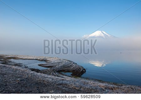 Reflection of Mountain Fuji fujisan with mist at yamanaka lake 