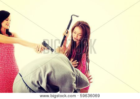 Two womans overpowered thug, isolated on white