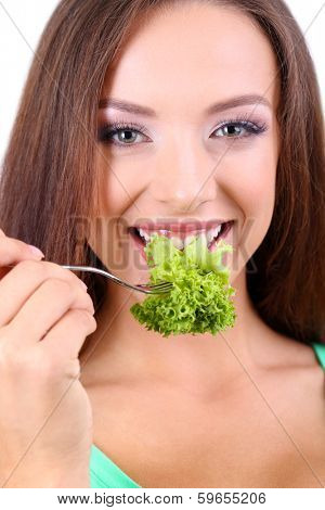 Beautiful girl with fresh salad close up