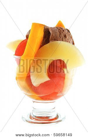 fresh raw  tropical fruits with chocolate ice cream in big glass isolated on white background