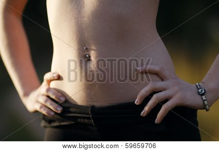 Girl belly with piercing