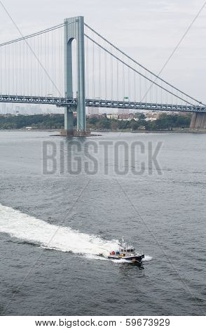 New York Police Boat Cruising Under Verrazano Bridge
