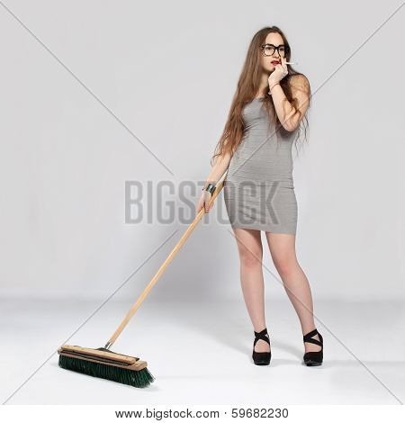Long-haired Teenager Girl In Gray Minis Cleans