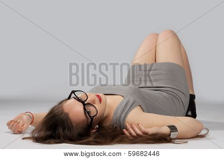 Long-haired Teenager Girl In Gray Minis In Cool Glasses And Black High Heels