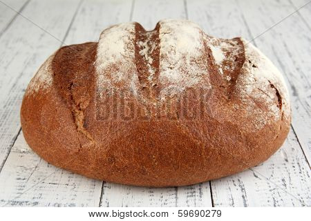 Rye bread on wooden background