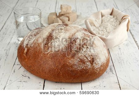 Composition with rye bread on wooden background