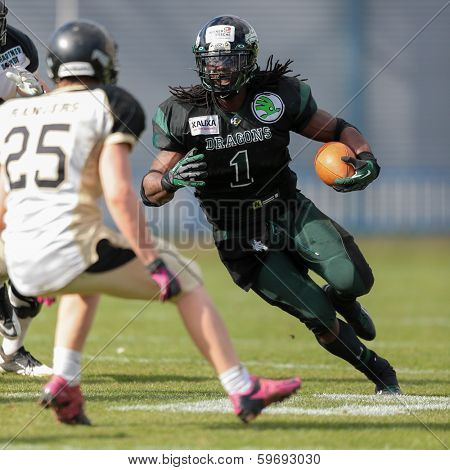 VIENNA,  AUSTRIA - APRIL 14 RB Tunde Ogun (#1 Dragons) runs with the ball during the AFL football game on April 14, 2013 in Vienna, Austria.