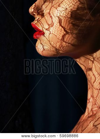 Profile Of Futuristic Woman's Face With Openwork Lace In Shadows