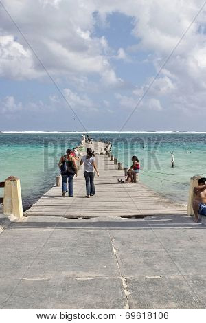 People on a twisted pier in Mexico