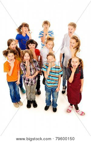 Group of children standing together and yawn. Isolated over white.