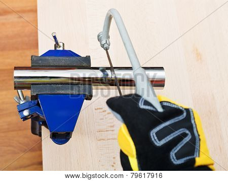Sanitary Technician Sawing Plumbing Drain Pipe