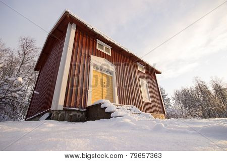 Traditional Swedish House In Winter