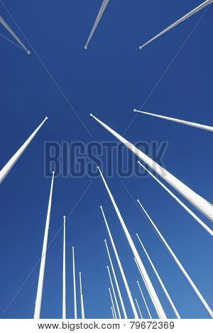 Masts no flag and clear blue sky.
