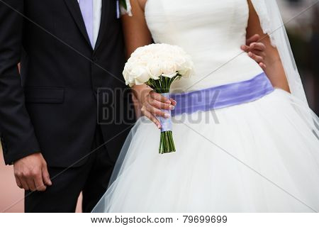 Bride holding floral bouquet