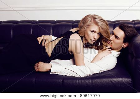 Beautiful Sensual Couple In Elegant Clothes Posing In Studio