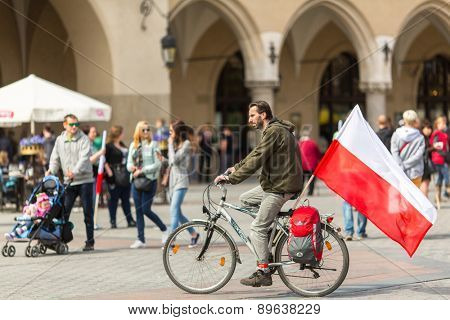 KRAKOW, POLAND - MAY 2, 2015: During Flag Day of the Republic of Polish - is national festival introduced by the Act of 20 Feb 2004. On the same day is celebrated Day of Polonia and Poles Abroad.
