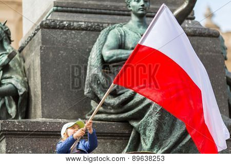 KRAKOW, POLAND - MAY 2, 2015: During Flag Day of the Republic of Polish - is national festival introduced by the Act of 20 Feb 2004. On the same day is celebrated Day of Polonia and Poles Abroad.