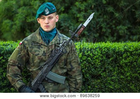 KRAKOW, POLAND - MAY 3, 2015: Polish soldiers at ceremony of laying flowers to monument to Hugo Kollataj during annual Polish national and public holiday the May 3rd Constitution Day (of May 3, 1791)