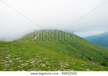 Fog And Clouds On The Mountain