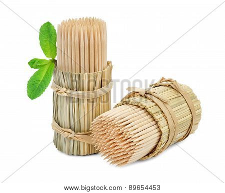 Toothpicks in packs of straw and a mint.