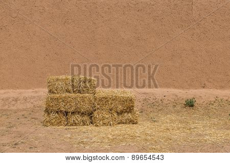 The Haystack In Front Of Dried Wall Made Of Soil And Straw As Afican Traditional In Morocco