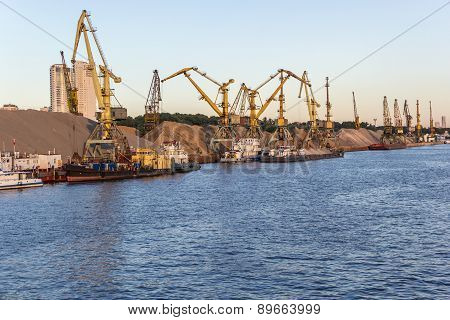 Barges And Cranes In River Port