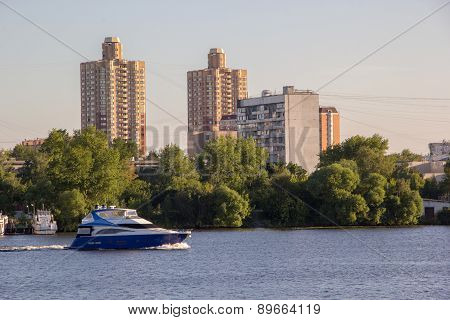 Motor Boat On River In City