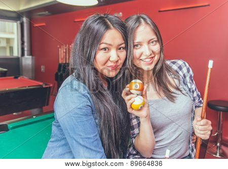 Two Girls Portrait In A Biliard Room.