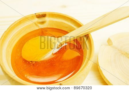 Honey In A Wooden Bowl