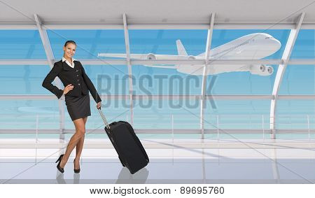 Smiling flight attendant in airport