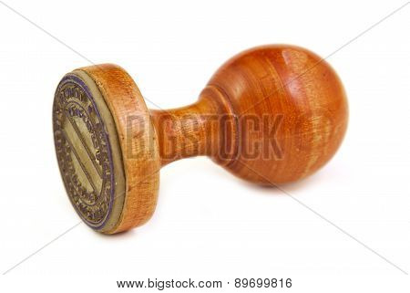 Old and vintage wooden stamper on a white background