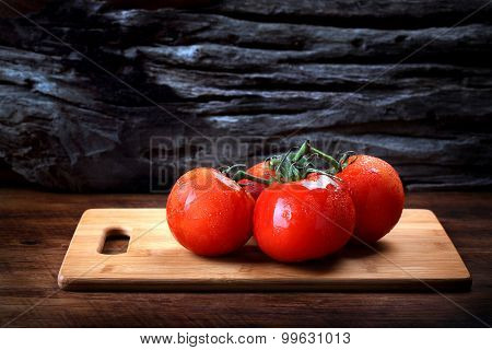 Cool Fresh Tomatoes On Wooden Tray With Wooden Background