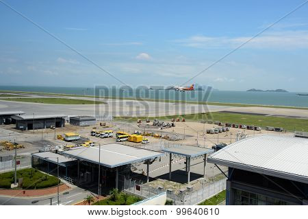 HONG KONG - JUNE 04, 2015: aircraft landing in Hong Kong International Airport. Hong Kong International Airport is the main airport in Hong Kong. It is located on the island of Chek Lap Kok