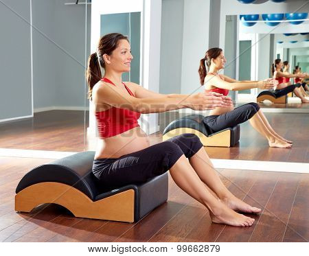 pregnant woman pilates exercise with spine wave corrector