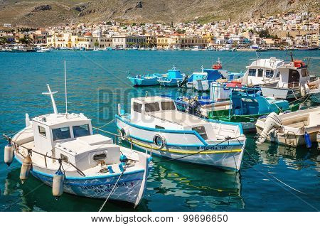 Wharf and cosy traditional Greek boats in Greece