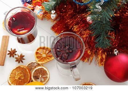 mulled wine with decorated christmas tree