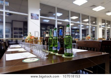ST. PETERSBURG, RUSSIA - OCTOBER 24, 2015: Beer bottles at the table during tasting session in the Baltika - St Petersburg brewery. This session is a part of the October Beer Festival celebrations